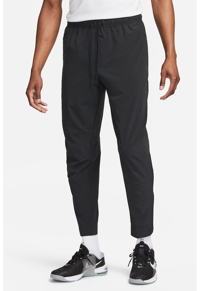 Pantaloni conici cu tehnologie Dri-FIT si slituri cu fermoar Unlimited - Negru