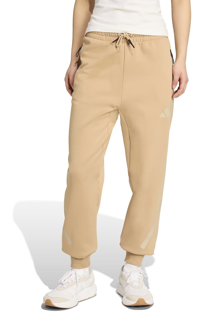 Pantaloni de trening cu buzunare cu fermoar Z.N.E. - Bej