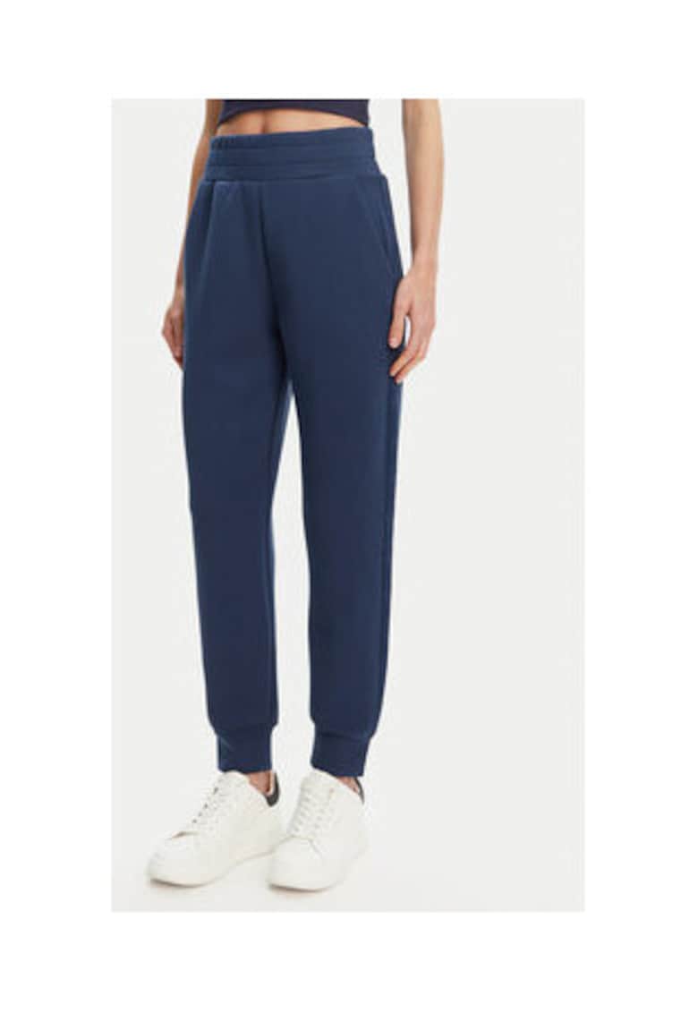 Pantaloni de trening pentru femei - cu buzunare laterale